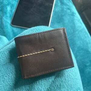 Classic Brown Leather Bifold Wallet with Snap Closure